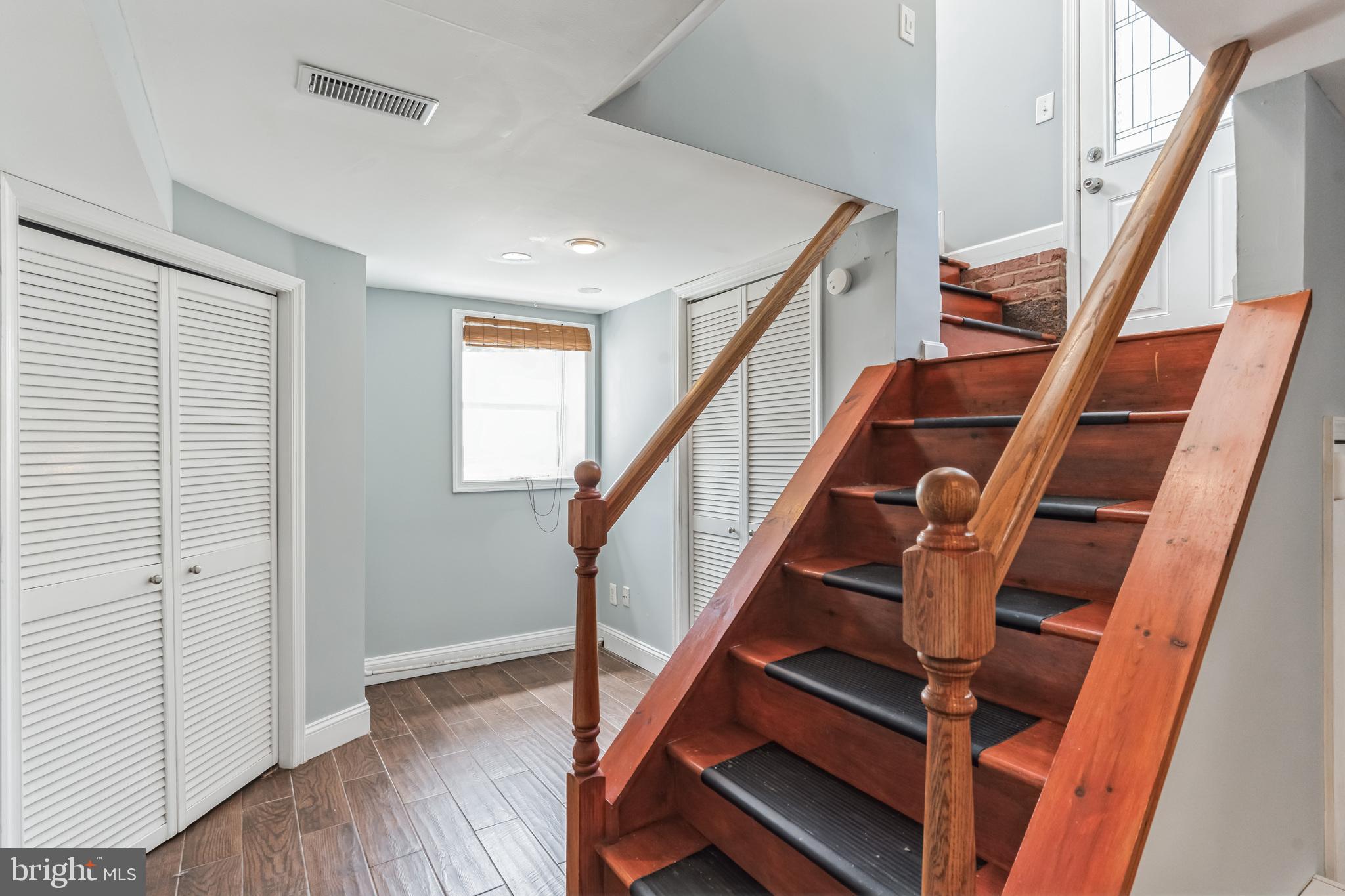 1316 South Buchanan Street Arlington, VA 22204 - Photo 22 of 28 a view of entryway with wooden floor and stairs