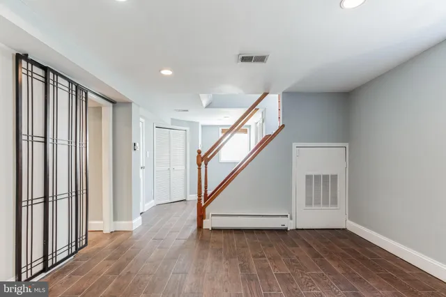 a kitchen with stainless steel appliances granite countertop a stove and a refrigerator