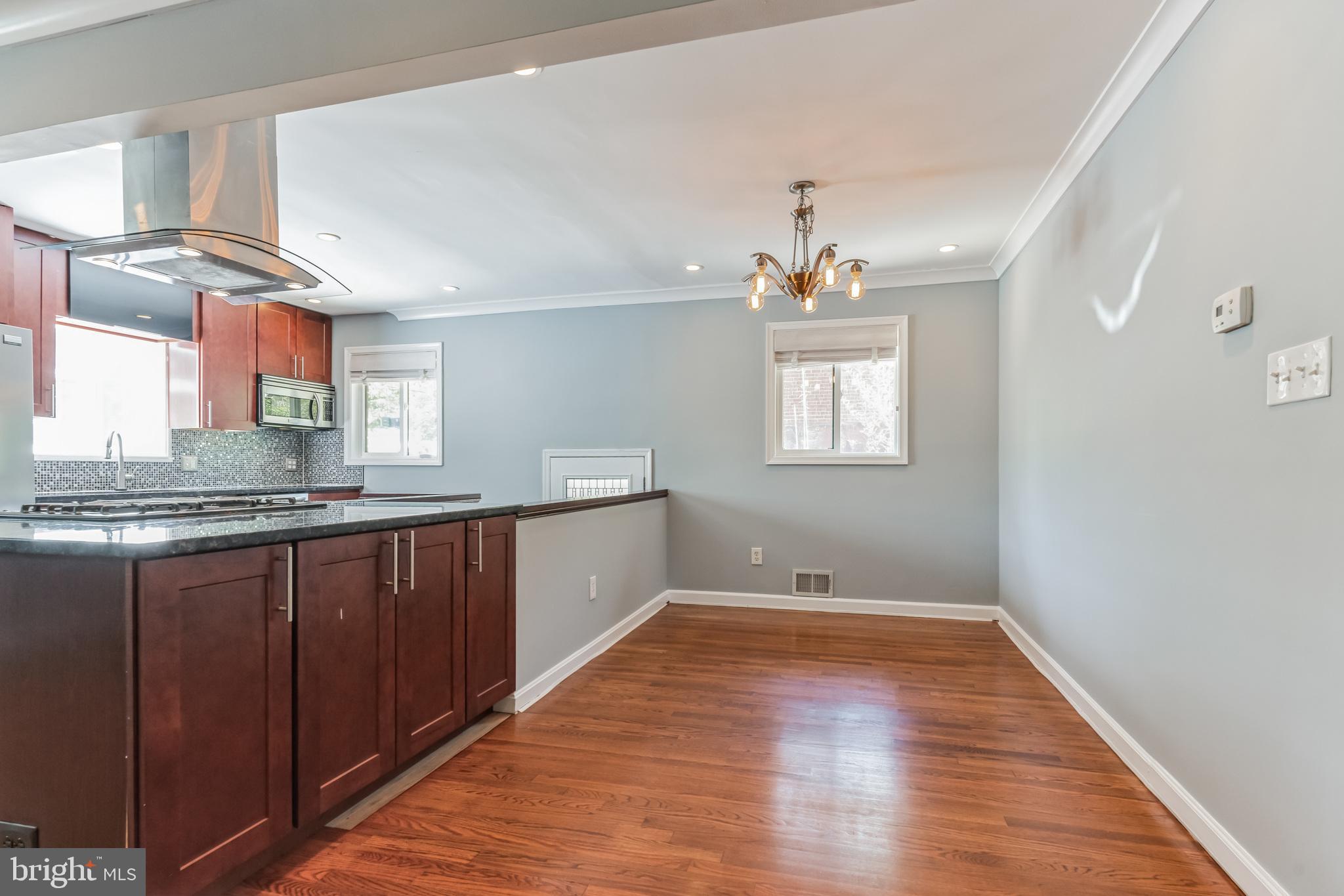 1316 South Buchanan Street Arlington, VA 22204 - Photo 27 of 28 a view of a kitchen with wooden floor and a sink