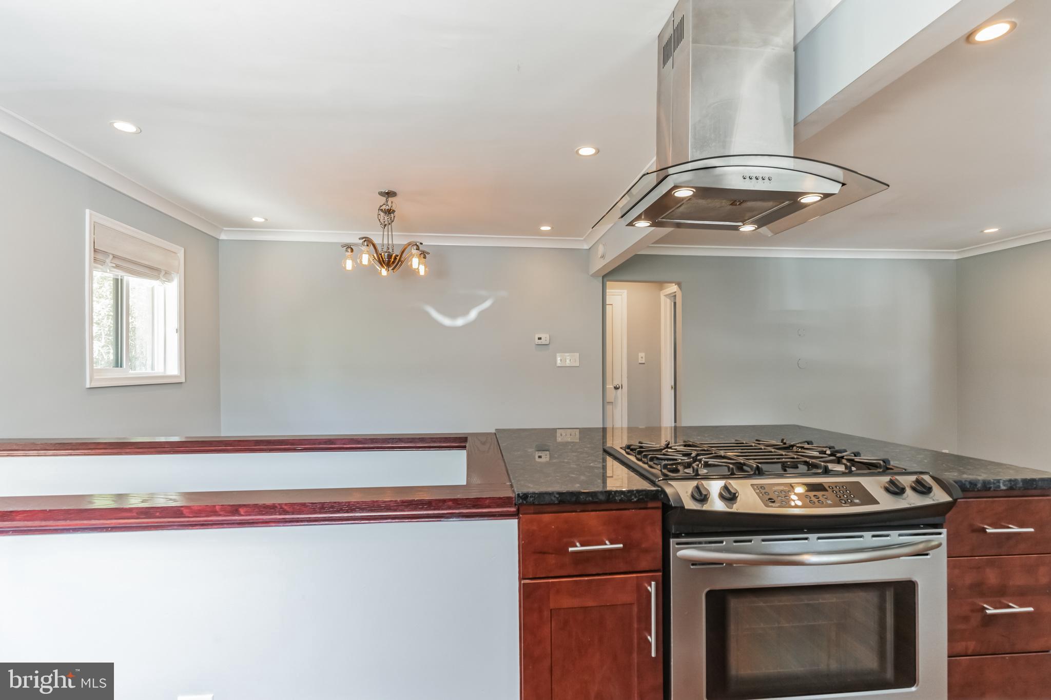 1316 South Buchanan Street Arlington, VA 22204 - Photo 5 of 28 a stove top oven sitting inside of a kitchen