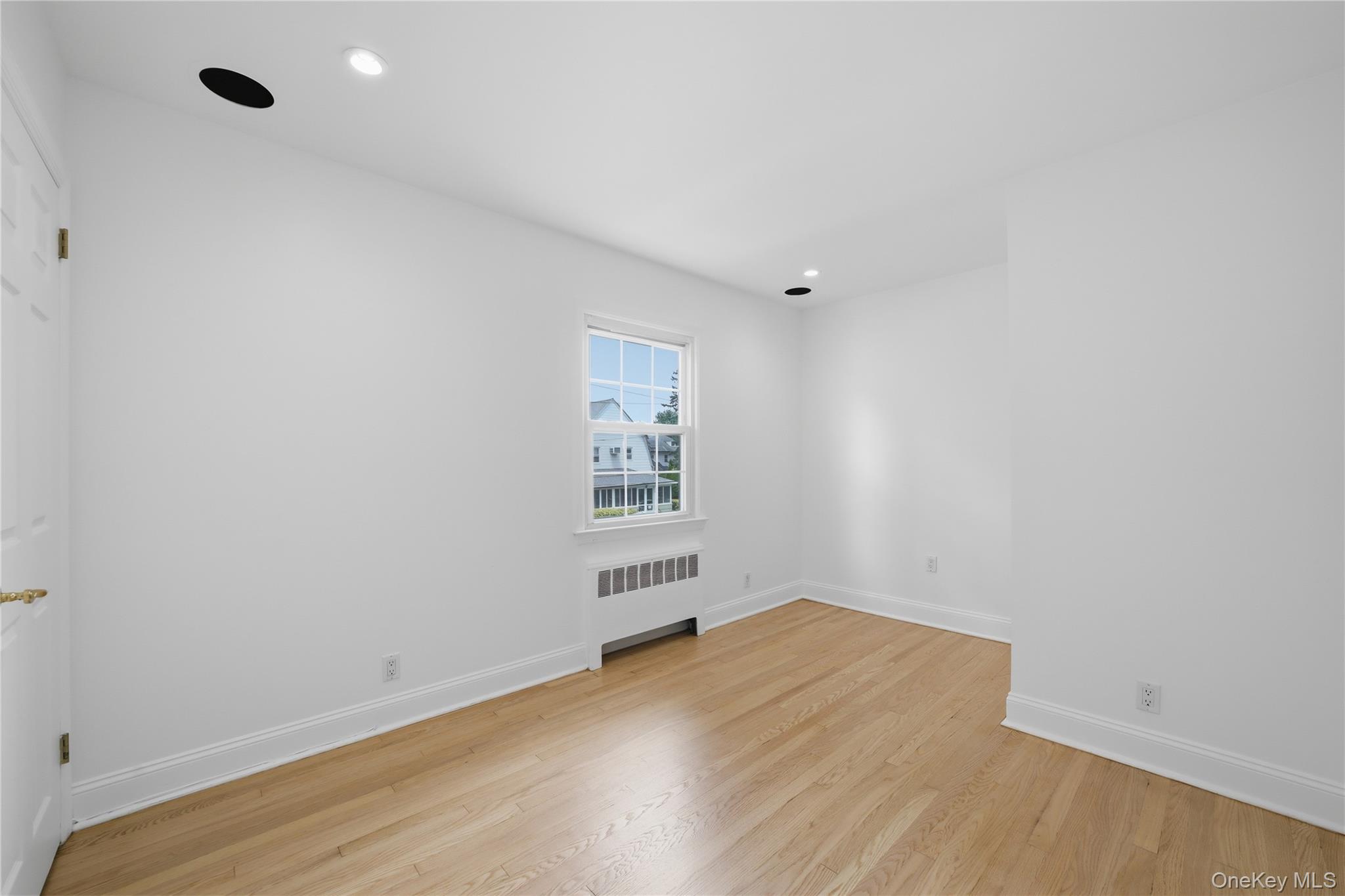 144 Bell Road Scarsdale, NY 10583 - Photo 28 of 49 Bright 3rd bedroom featuring wood-finish flooring, white walls, and recessed lighting