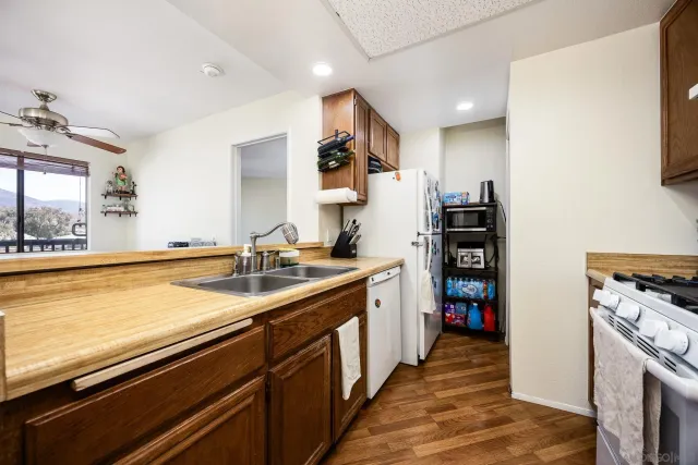 a kitchen with stainless steel appliances a sink and a stove