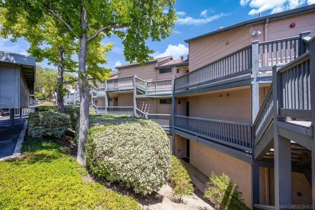 front view of a house with a tree