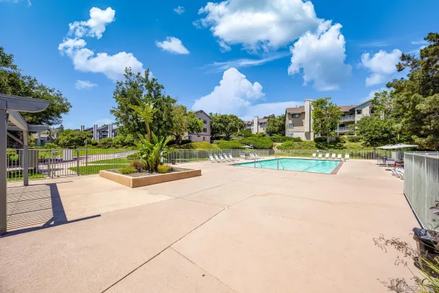 a view of a park with houses