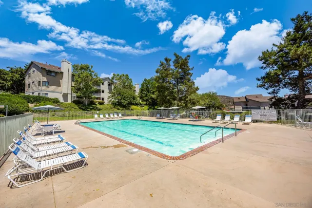 a view of a patio with swimming pool