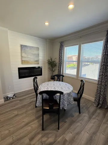 a dining room with furniture and window