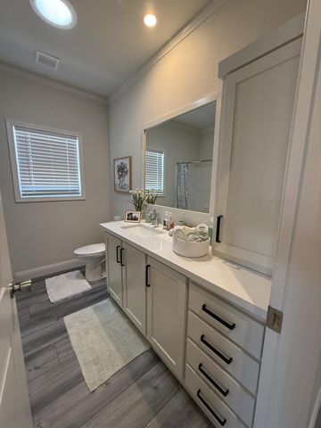 a bathroom with a double vanity sink and mirror