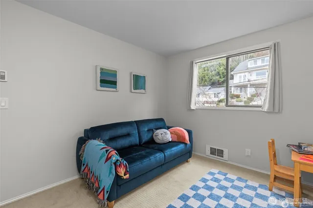 a bedroom with furniture and a window