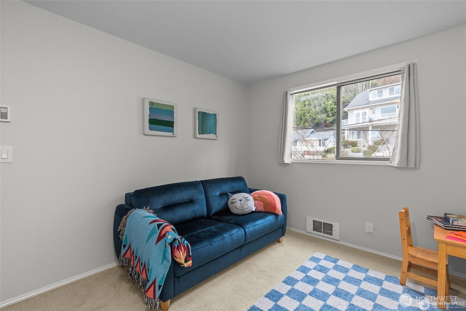 4222 Beach Drive Southwest, Unit 303 Seattle, WA 98116 - Photo 20 of 25 a bedroom with furniture and a window