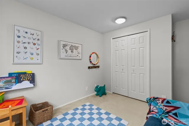 a bedroom with furniture and a window