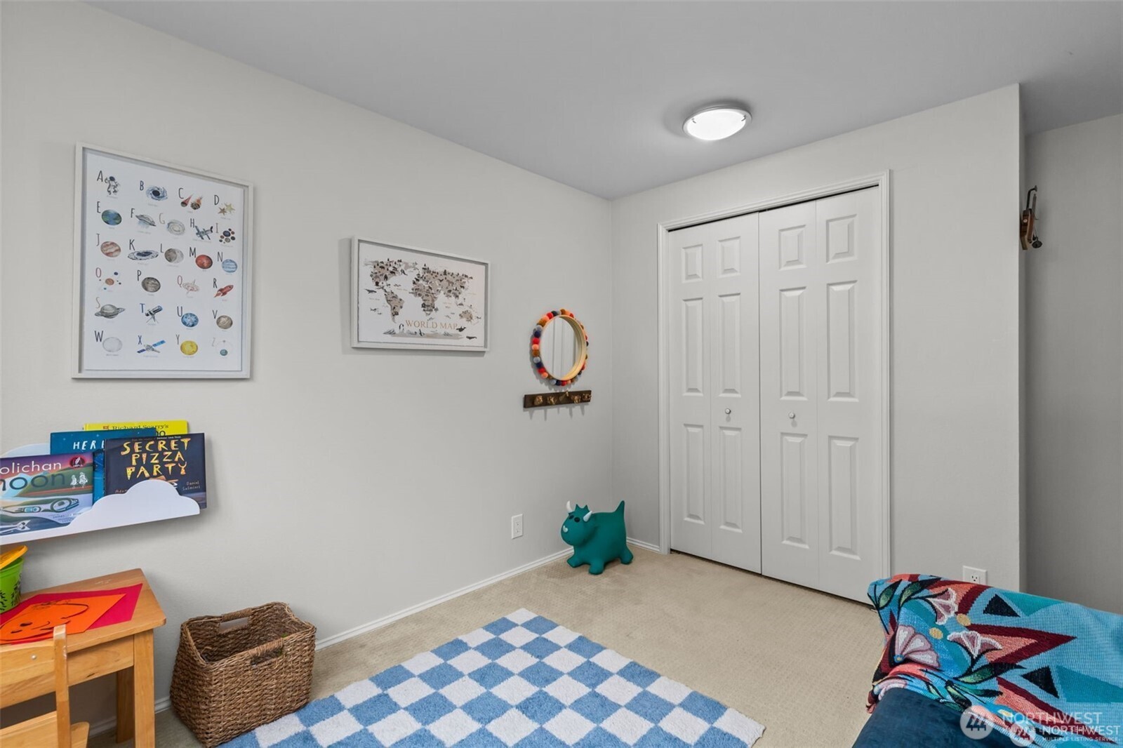 4222 Beach Drive Southwest, Unit 303 Seattle, WA 98116 - Photo 22 of 25 a bedroom with furniture and a window