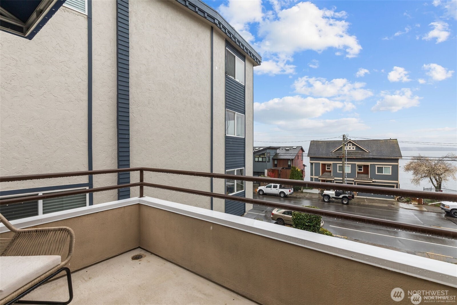 4222 Beach Drive Southwest, Unit 303 Seattle, WA 98116 - Photo 24 of 25 a view of a balcony with furniture
