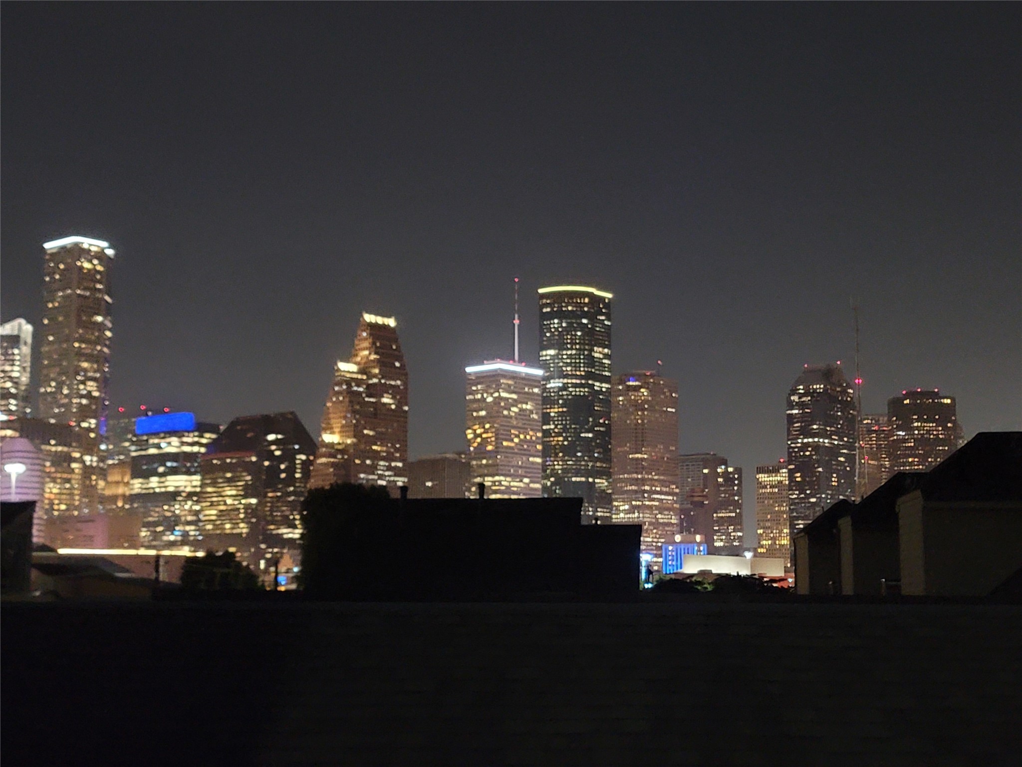 a view of a dining room with furniture and a chandelier