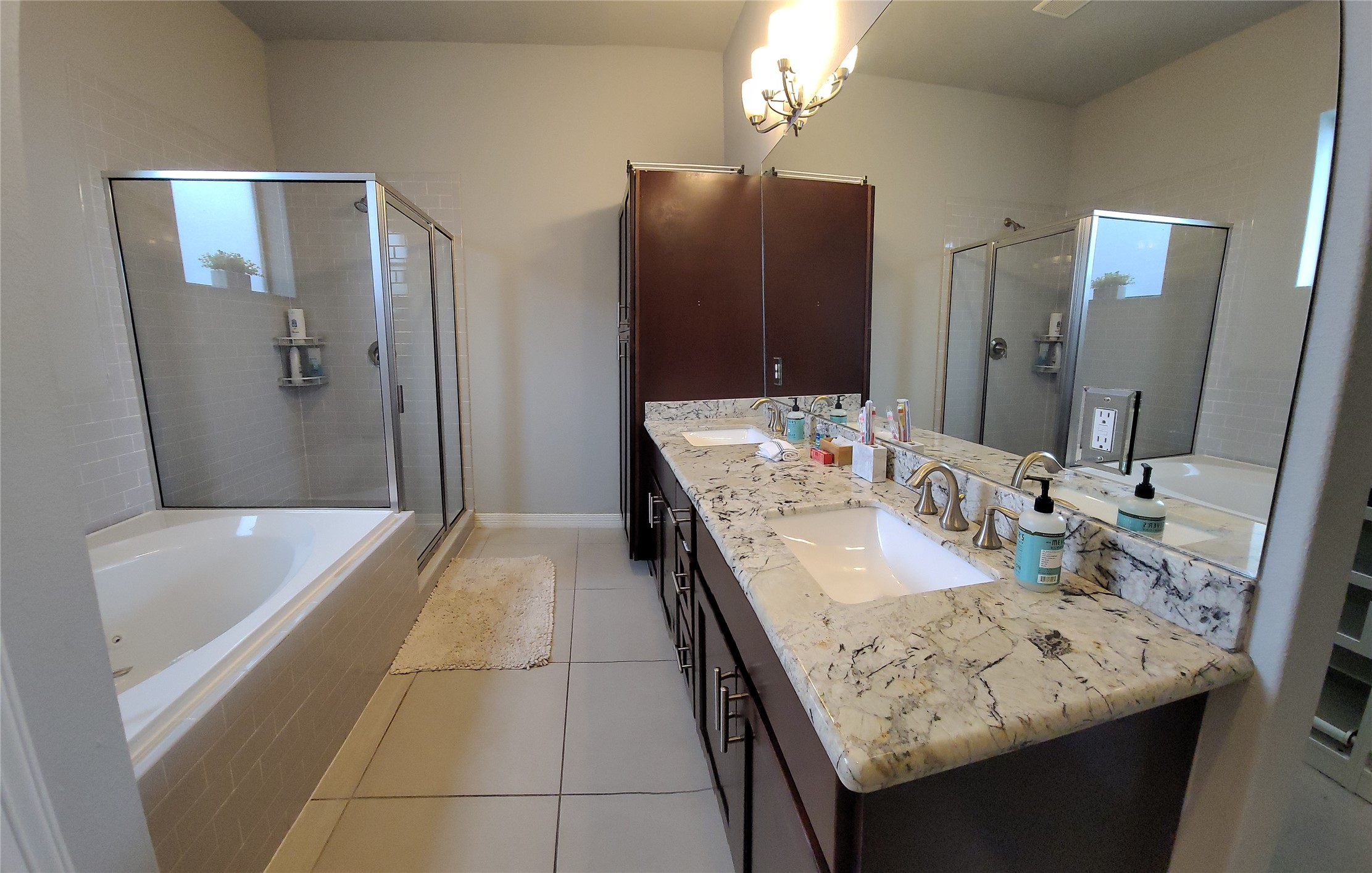 1413 Holly Street, Unit A Houston, TX 77007 - Photo 22 of 33 a bathroom with a granite countertop sink a mirror and a bathtub