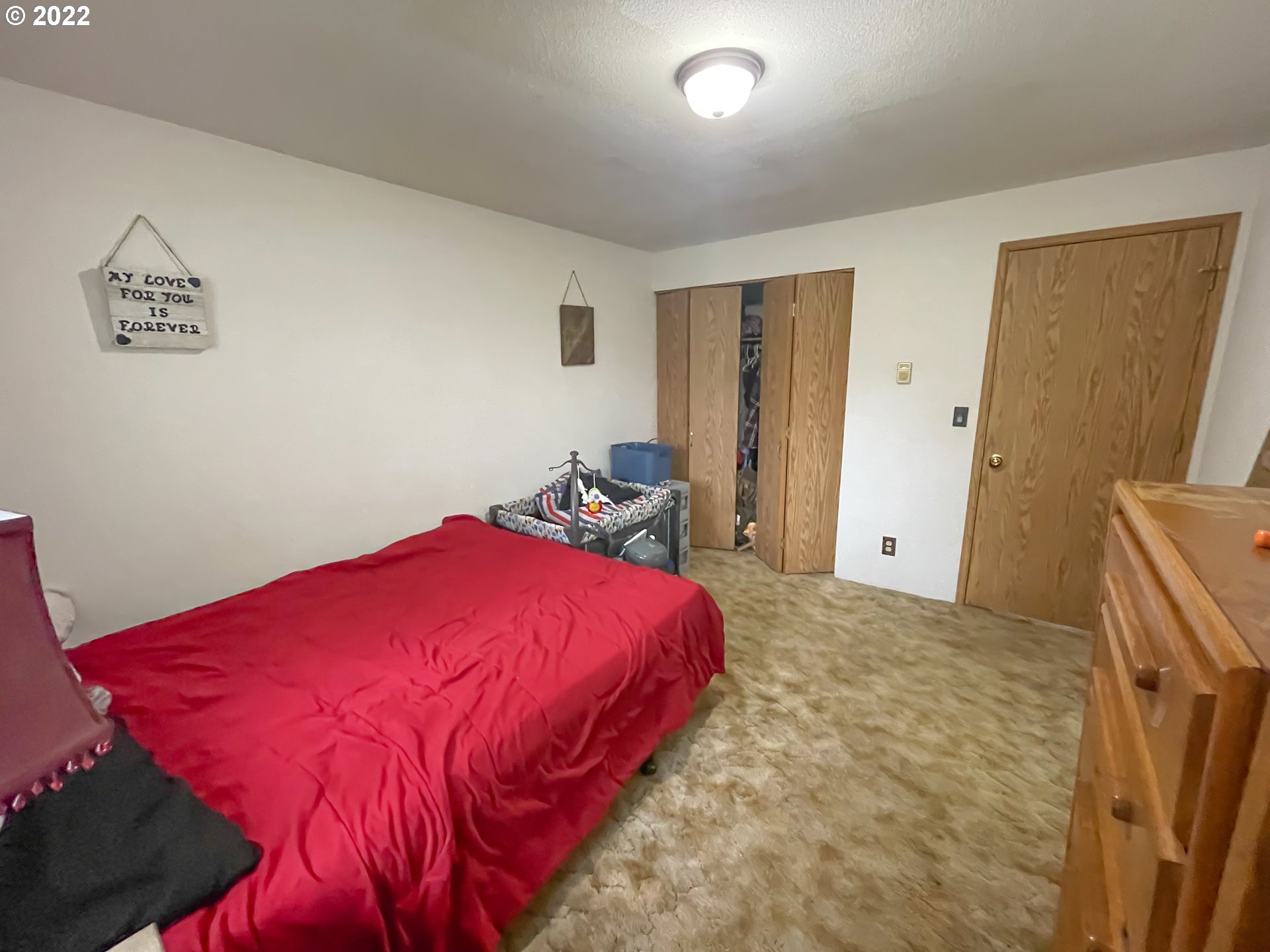 306 Columbia Loop Road Roseburg, OR 97471 - Photo 17 of 17 a bedroom with a bed and a refrigerator