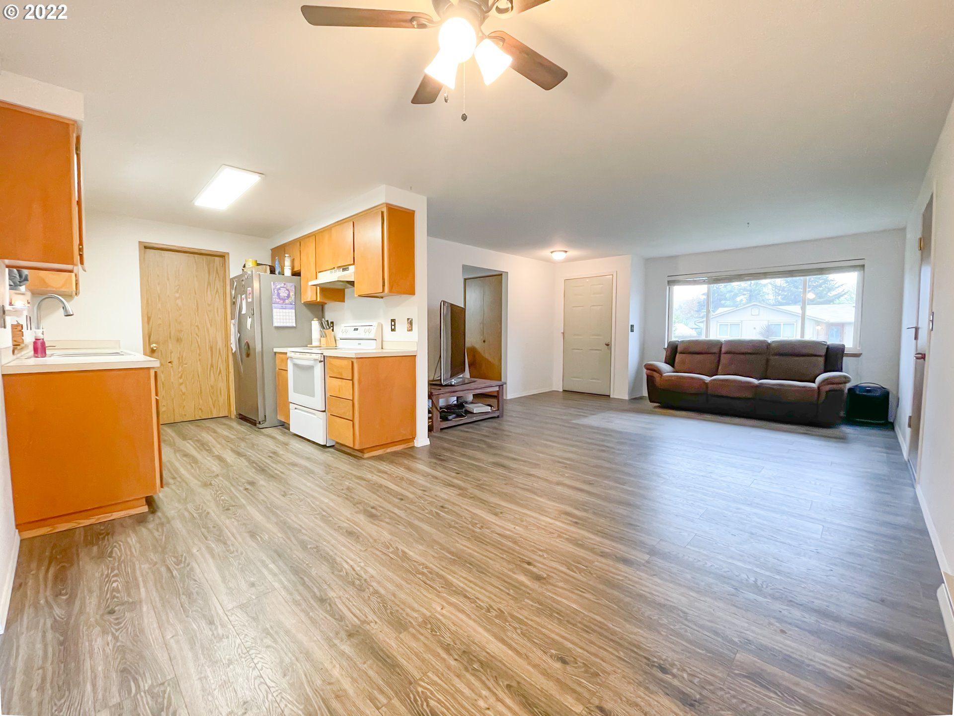 306 Columbia Loop Road Roseburg, OR 97471 - Photo 4 of 17 a living room with furniture and a wooden floor