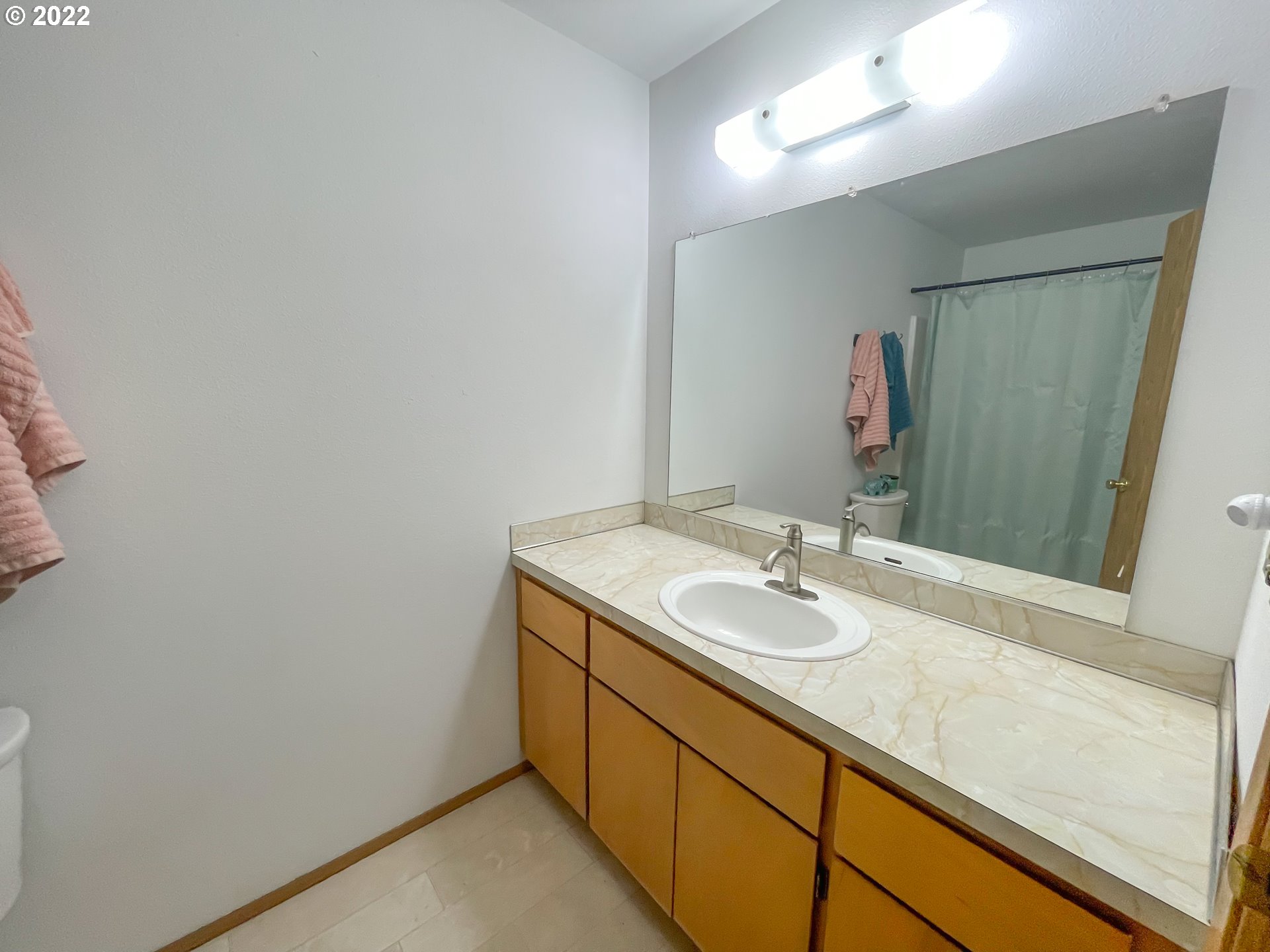 306 Columbia Loop Road Roseburg, OR 97471 - Photo 10 of 17 a bathroom with a granite countertop sink and a mirror