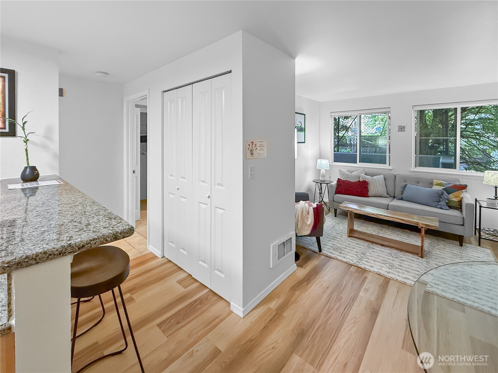 300 10th Avenue, Unit B105 Seattle, WA 98122 - Photo 20 of 40 a living room with furniture and a rug