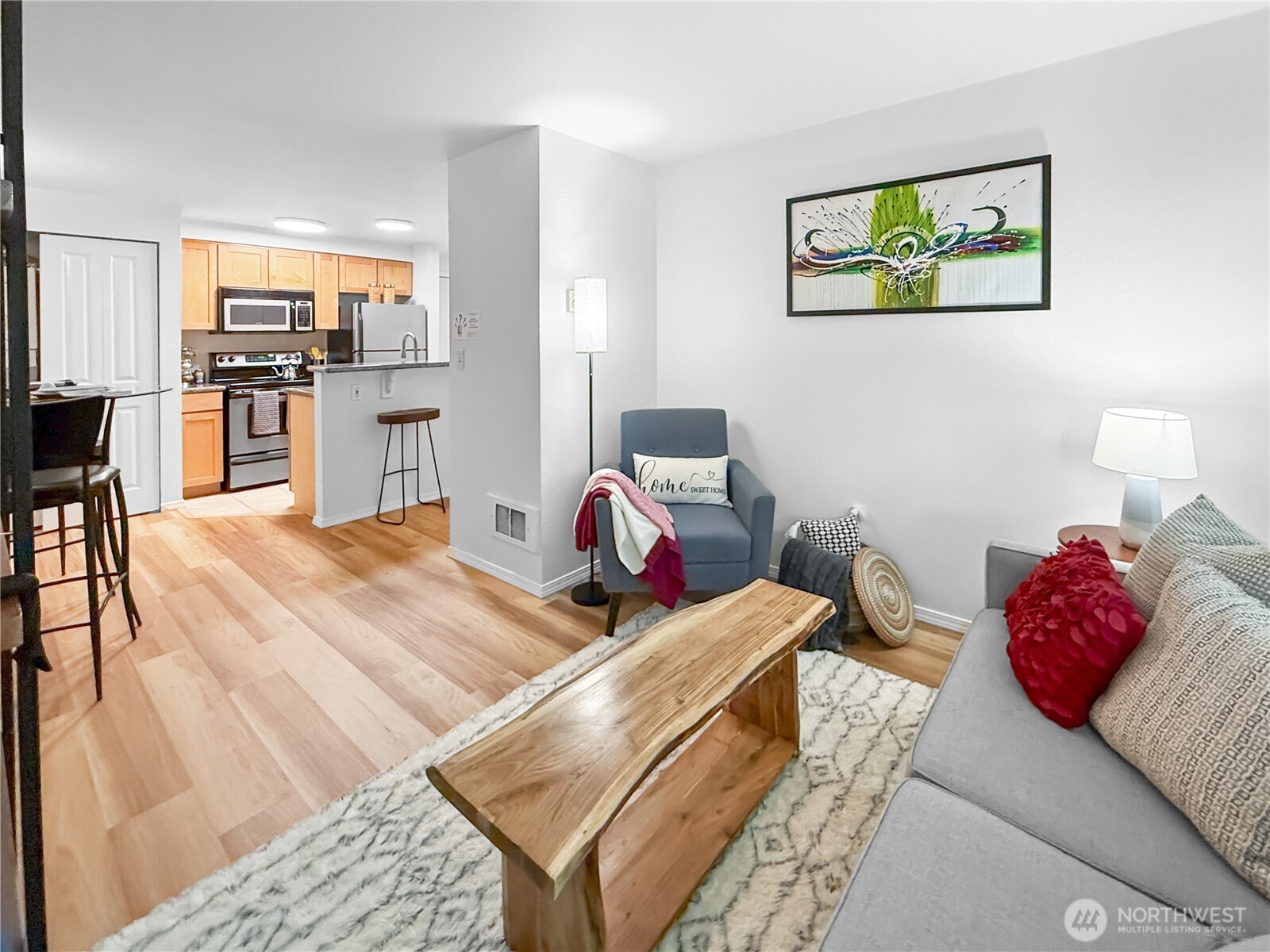 300 10th Avenue, Unit B105 Seattle, WA 98122 - Photo 21 of 40 a bedroom with a bed and wooden floor
