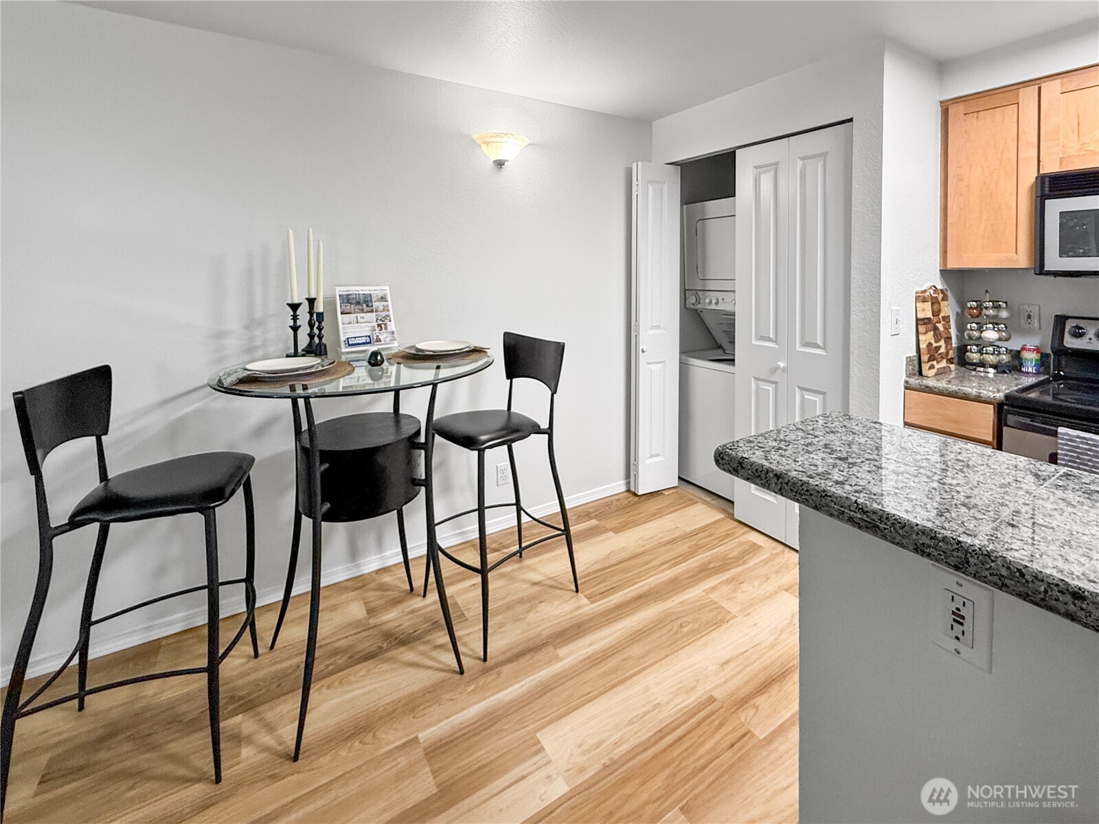 300 10th Avenue, Unit B105 Seattle, WA 98122 - Photo 25 of 40 a view of a dining room with furniture and wooden floor