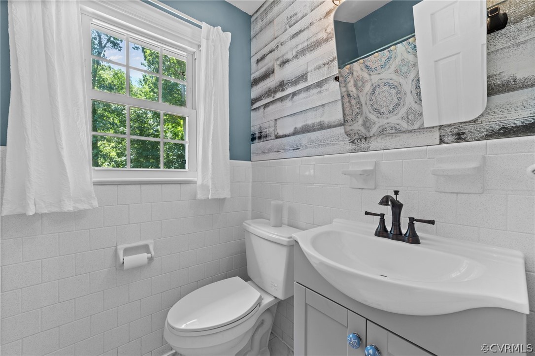 4201 Hidden Valley Road Chester, VA 23831 - Photo 16 of 30 a bathroom with a sink a toilet and a window