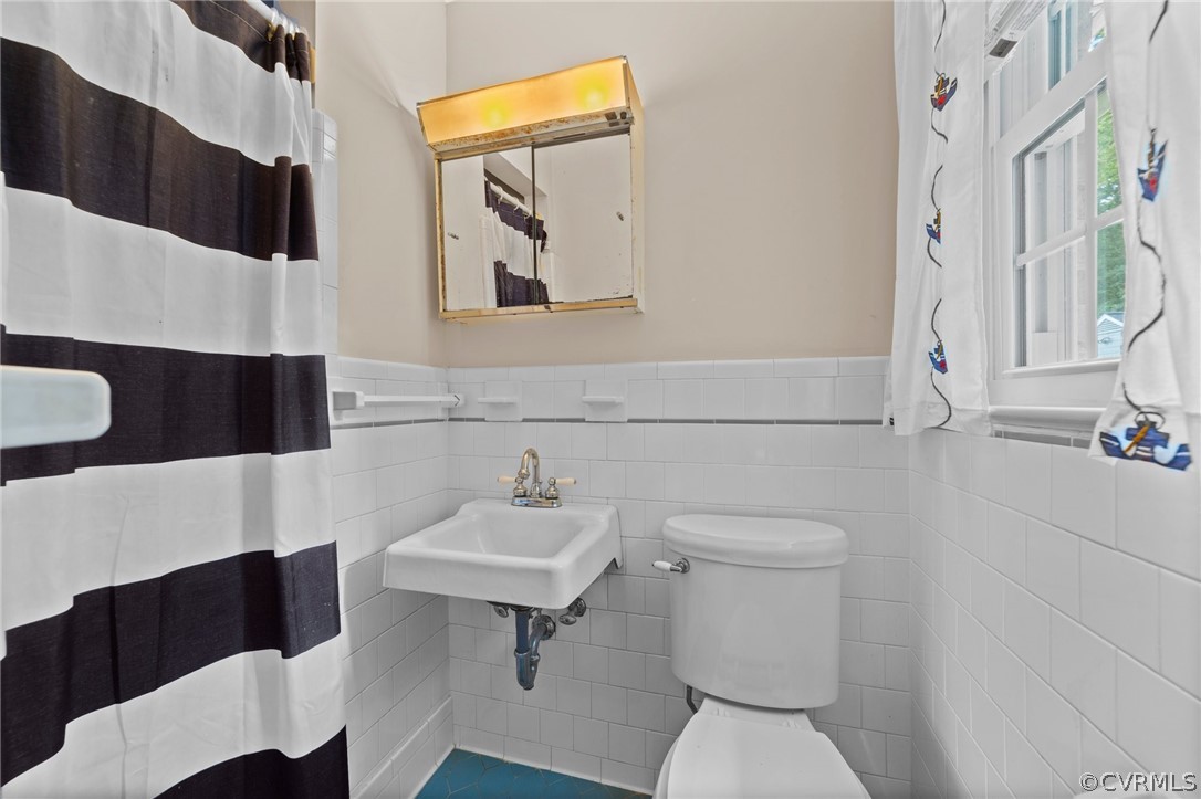4201 Hidden Valley Road Chester, VA 23831 - Photo 19 of 30 a bathroom with a sink toilet and mirror