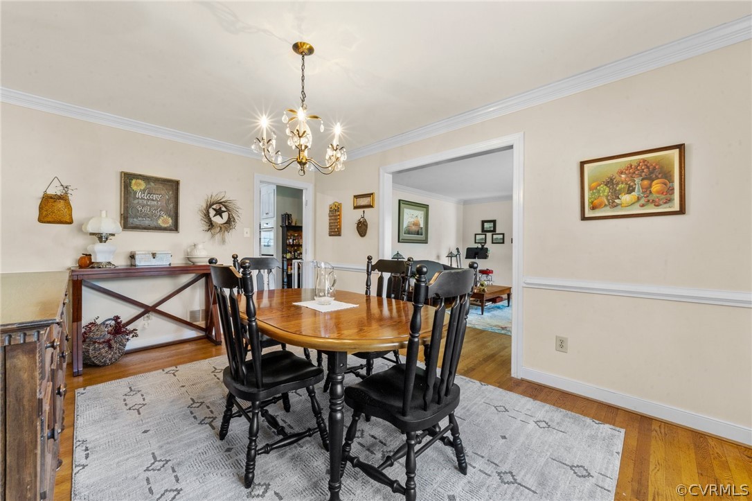 4201 Hidden Valley Road Chester, VA 23831 - Photo 9 of 30 a view of a dining room with furniture and a chandelier
