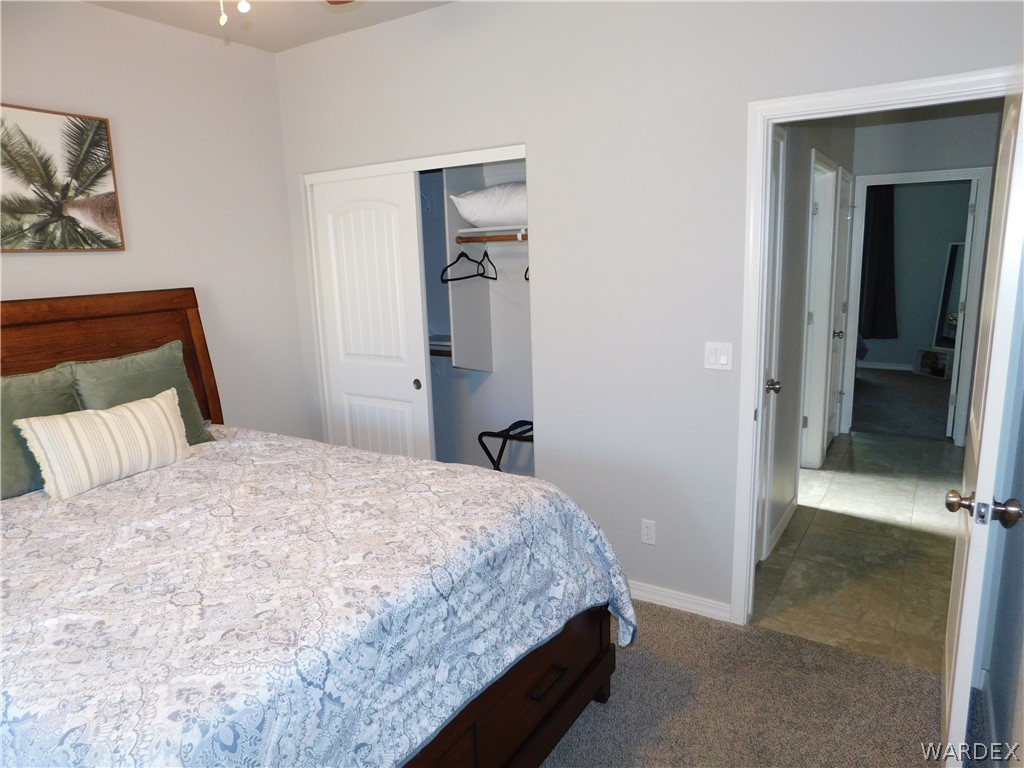 3370 South Ridge Avenue Bullhead City, AZ 86429 - Photo 47 of 56 a bedroom with a bed and wall painting