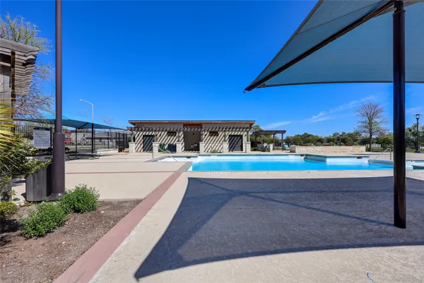 a house with swimming pool in front of it