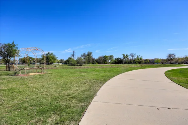 a view of a garden and basketball court