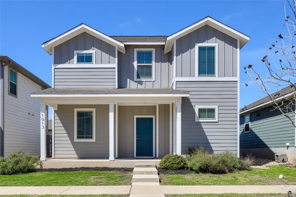 front view of a house with a yard