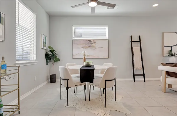 a dining room with furniture and window