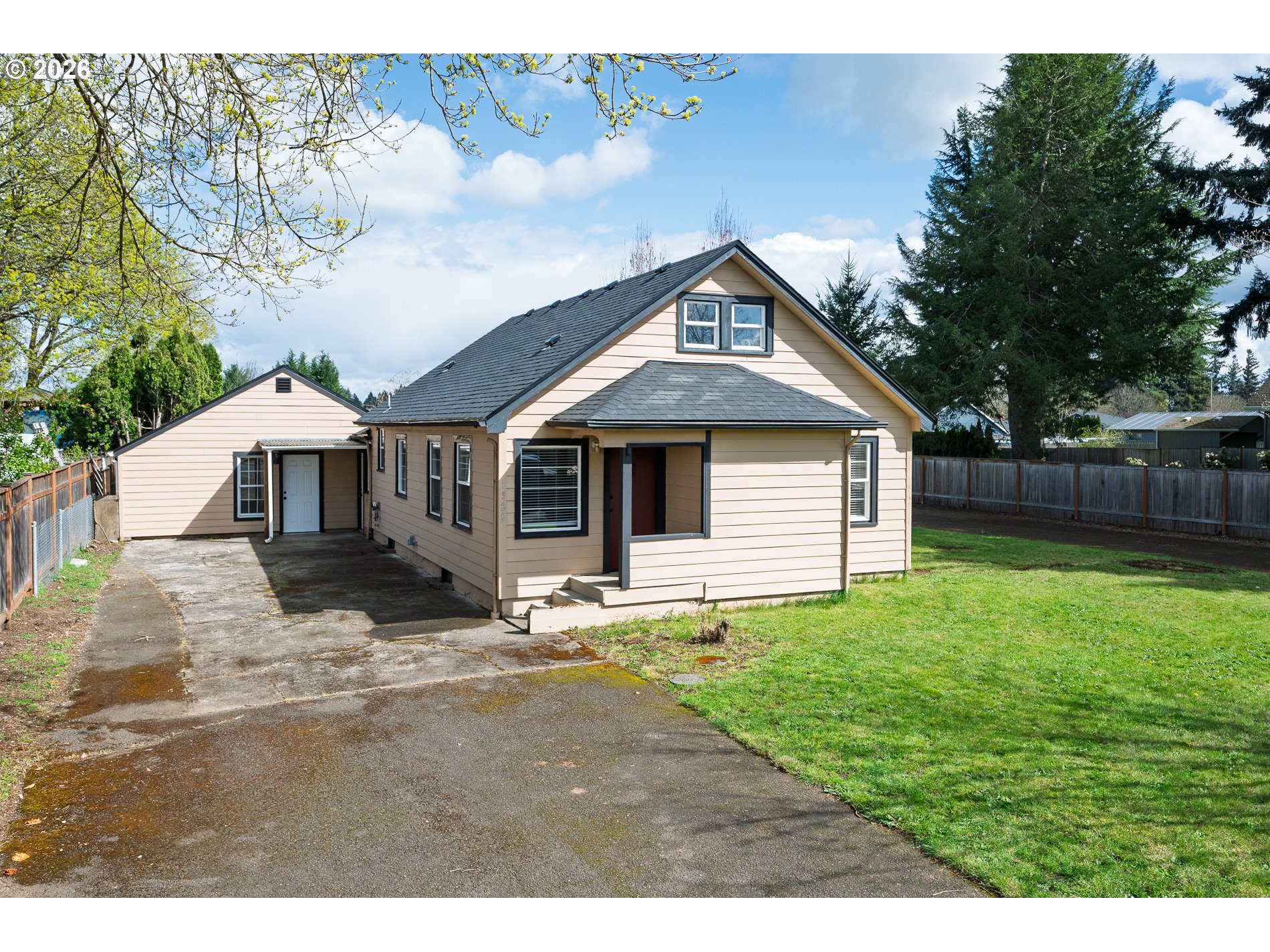 1520 North Maple Street Canby, OR 97013 - Photo 1 of 46 a front view of a house with a yard