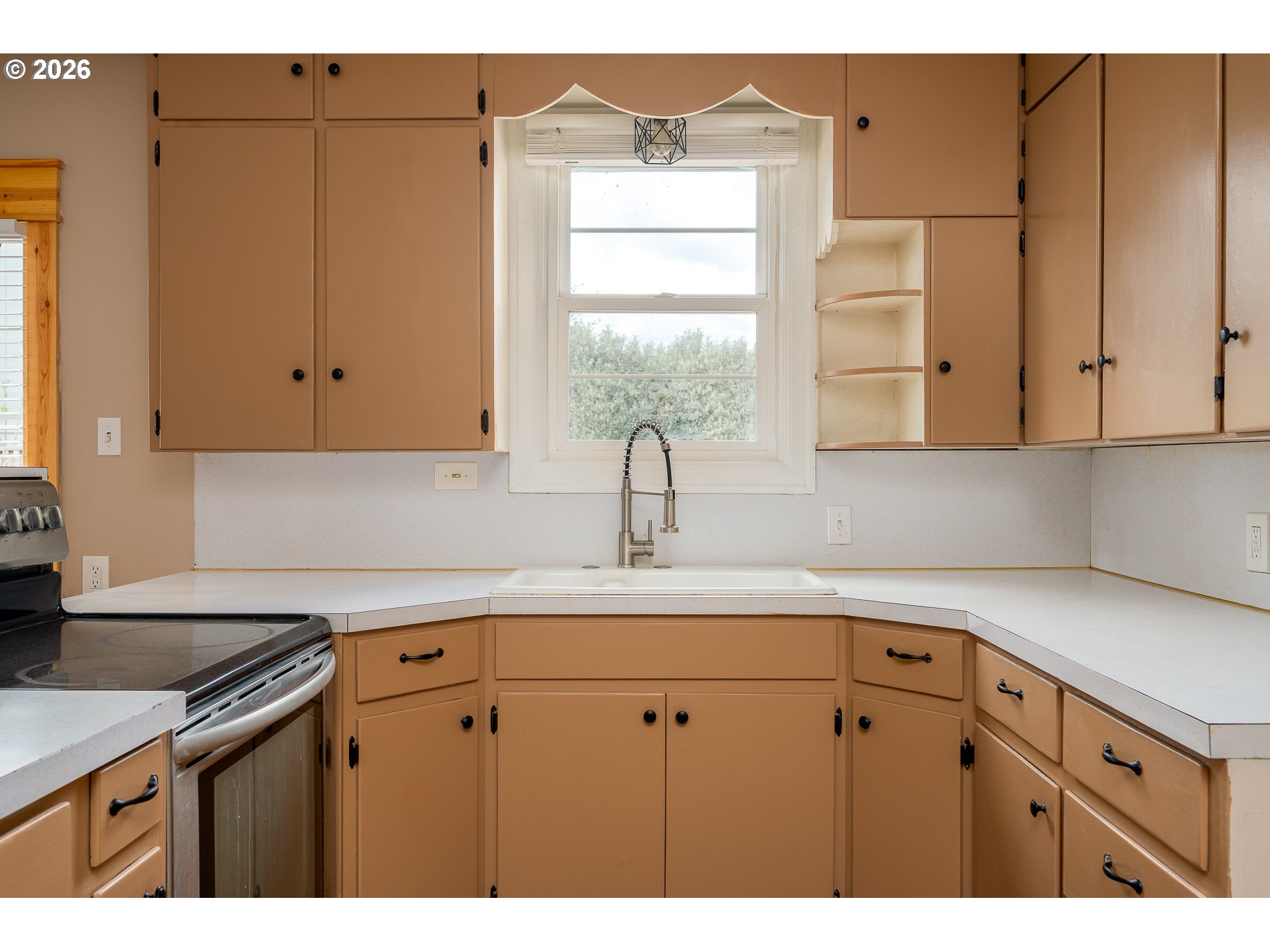 1520 North Maple Street Canby, OR 97013 - Photo 13 of 46 a kitchen with stainless steel appliances white cabinets and a sink