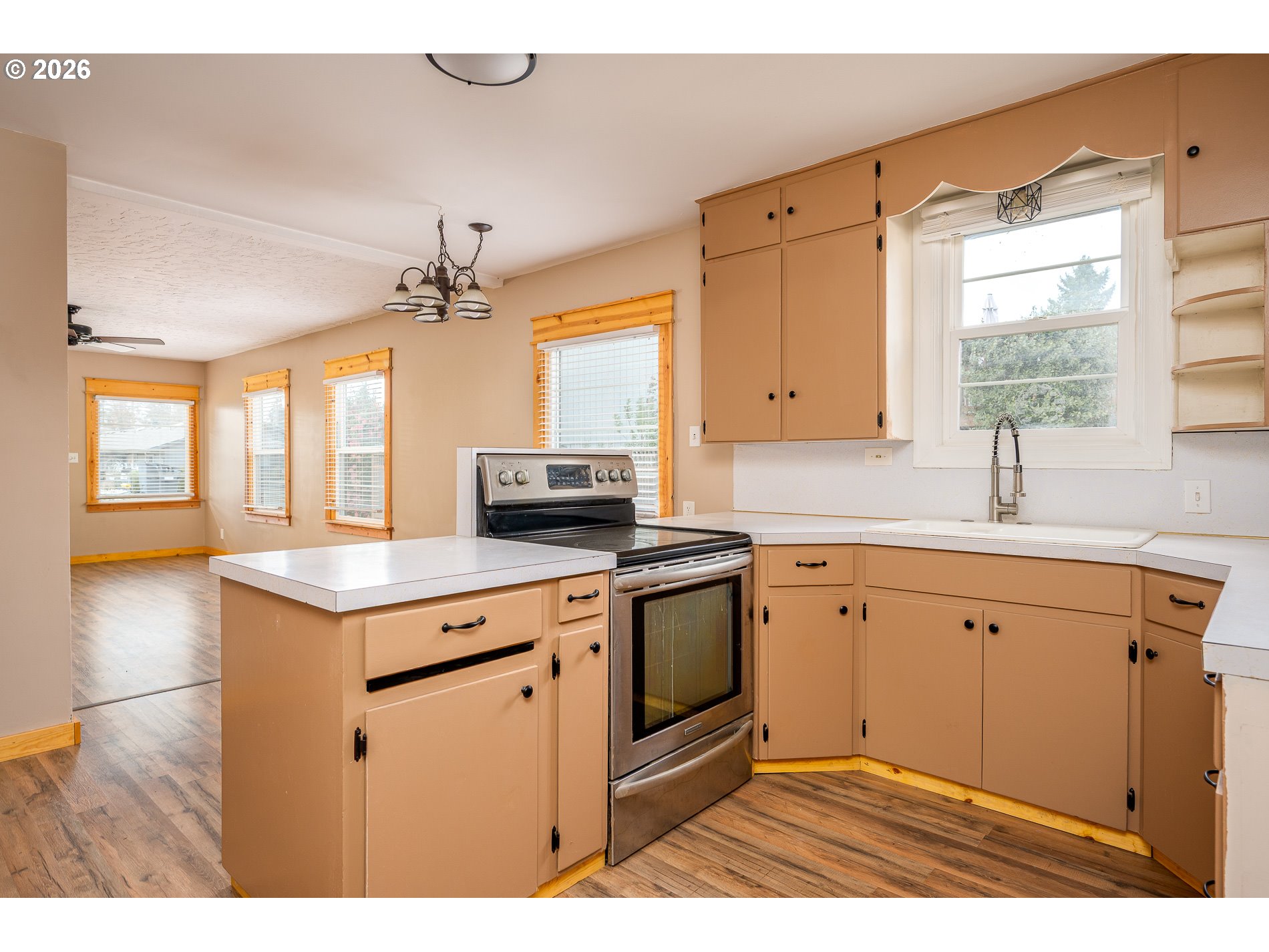 1520 North Maple Street Canby, OR 97013 - Photo 14 of 46 a kitchen with stainless steel appliances granite countertop a sink stove and refrigerator