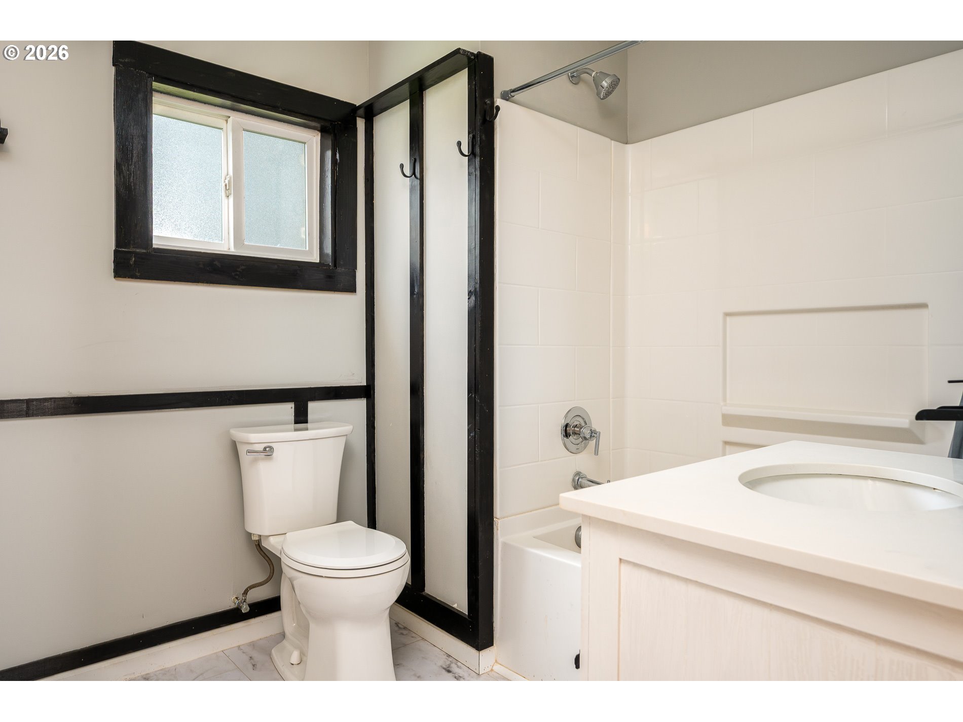 1520 North Maple Street Canby, OR 97013 - Photo 18 of 46 a bathroom with a toilet a sink and a mirror