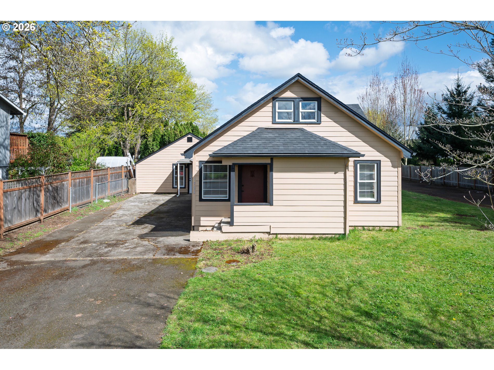 1520 North Maple Street Canby, OR 97013 - Photo 2 of 46 a front view of a house with garden