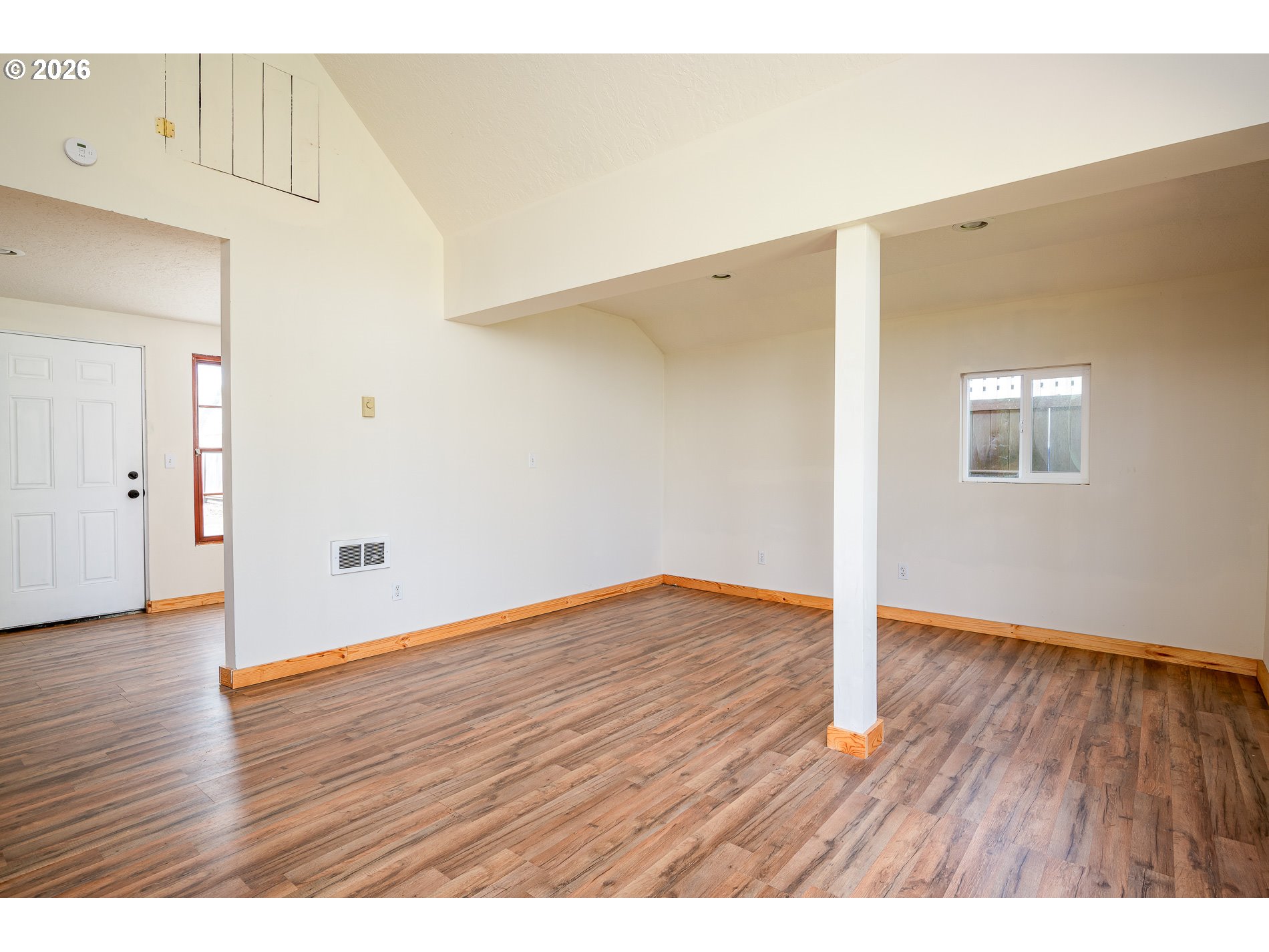 1520 North Maple Street Canby, OR 97013 - Photo 30 of 46 a view of an empty room with wooden floor