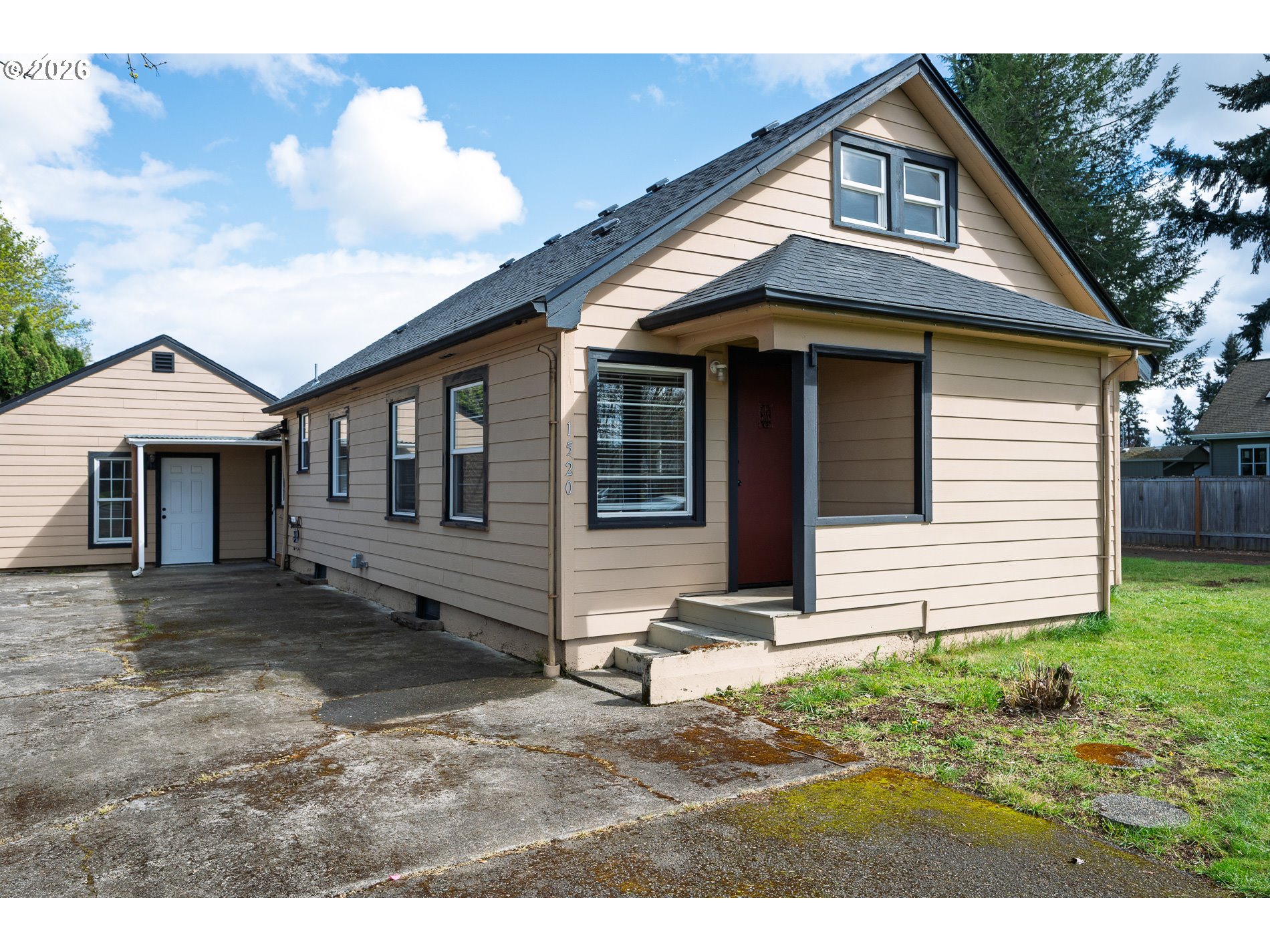 1520 North Maple Street Canby, OR 97013 - Photo 3 of 46 a view of a house with backyard and garden