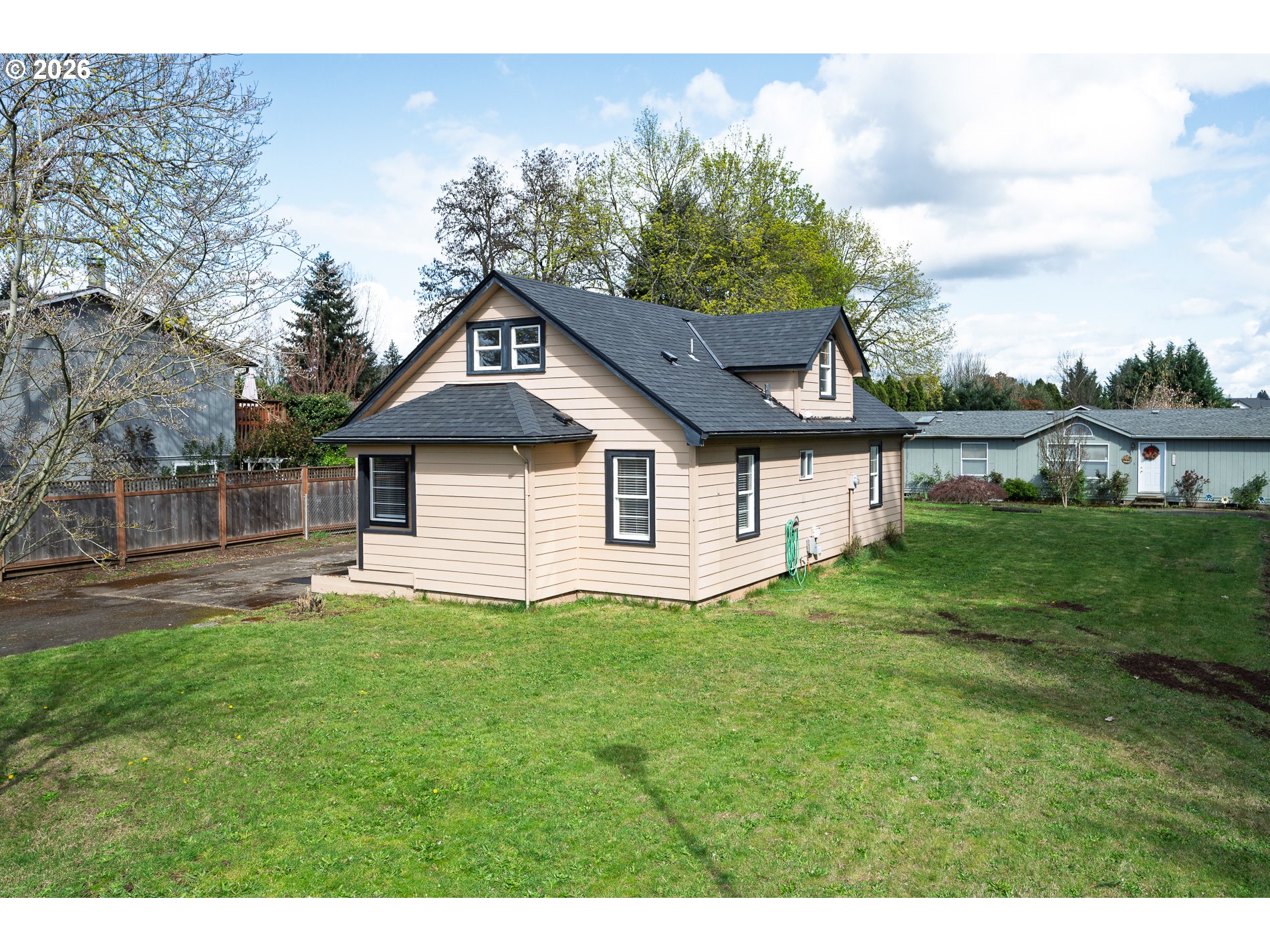 1520 North Maple Street Canby, OR 97013 - Photo 43 of 46 a front view of a house with a yard and garage