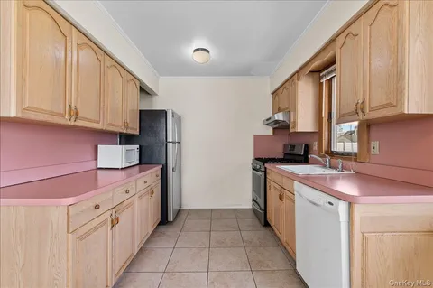 a kitchen with stainless steel appliances granite countertop a sink and cabinets