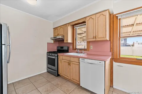 a kitchen with a stove and a refrigerator