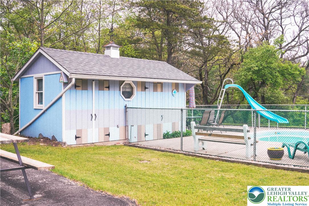 13 Craig Road Lehighton, PA 18235 - Photo 11 of 39 This charming utility building complements the refreshing pool and slide, creating an inviting outdoor oasis.
