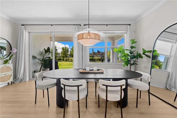 a dining room with furniture and window