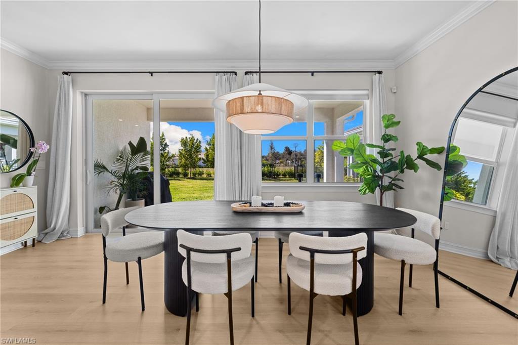 488 Polihale Way Naples, FL 34114 - Photo 21 of 49 a dining room with furniture and window