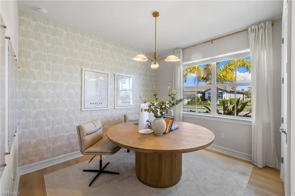 a dining room with furniture and window