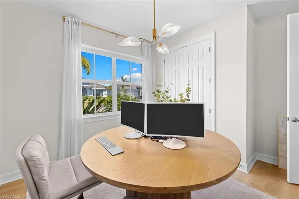 a workspace with furniture and window