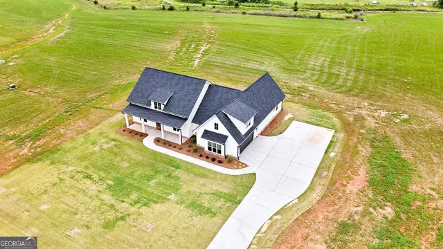 a view of an ocean with a floor to ceiling window and floor to ceiling window