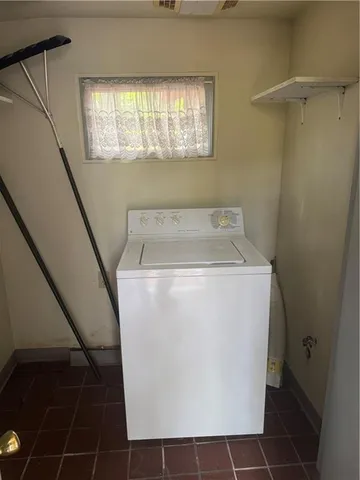 a utility room with a window dryer and washer