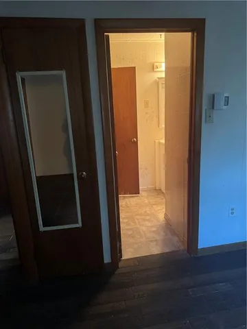 an empty room with wooden floor